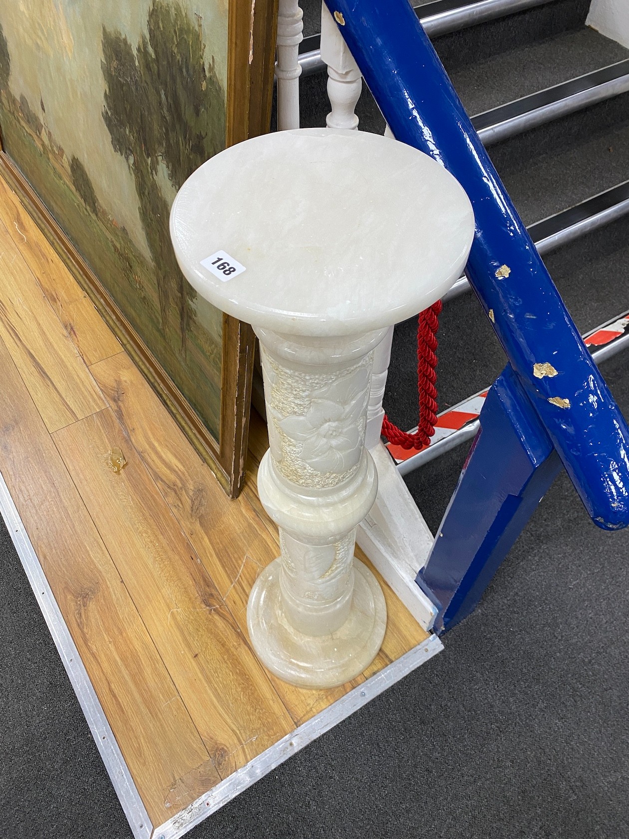 A carved alabaster column, height 99cm.